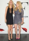 Gwyneth Paltrow Showing legs in a short black dress at The Conversation Launch Celebration in NYC